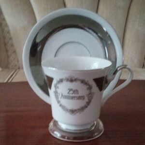 Rolex 25th Anniversary Silver Tea Cup and Saucer Set